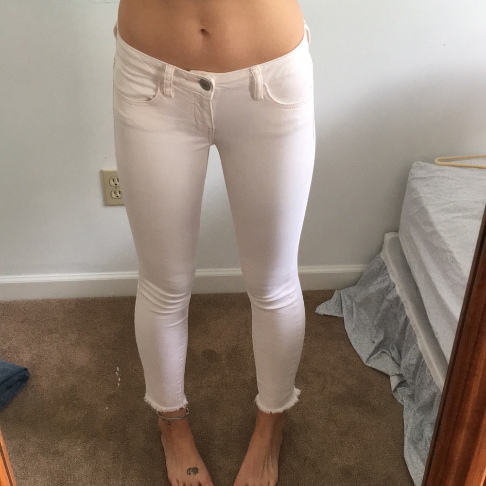 AE cream colored jeans with frayed ends